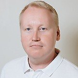 Врач Туганов Роман Андреевич